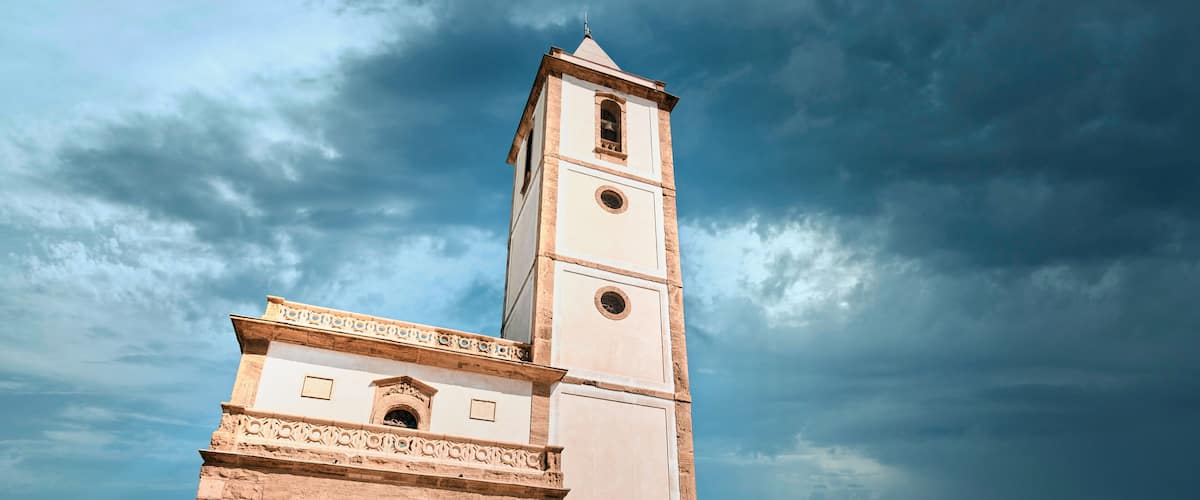 church Las Salinas of Cabo de Gata, built in year 1907, next to the road and the beach in Almadraba de Monteleva (Almeria, Andalusia, Spain, Europe)
