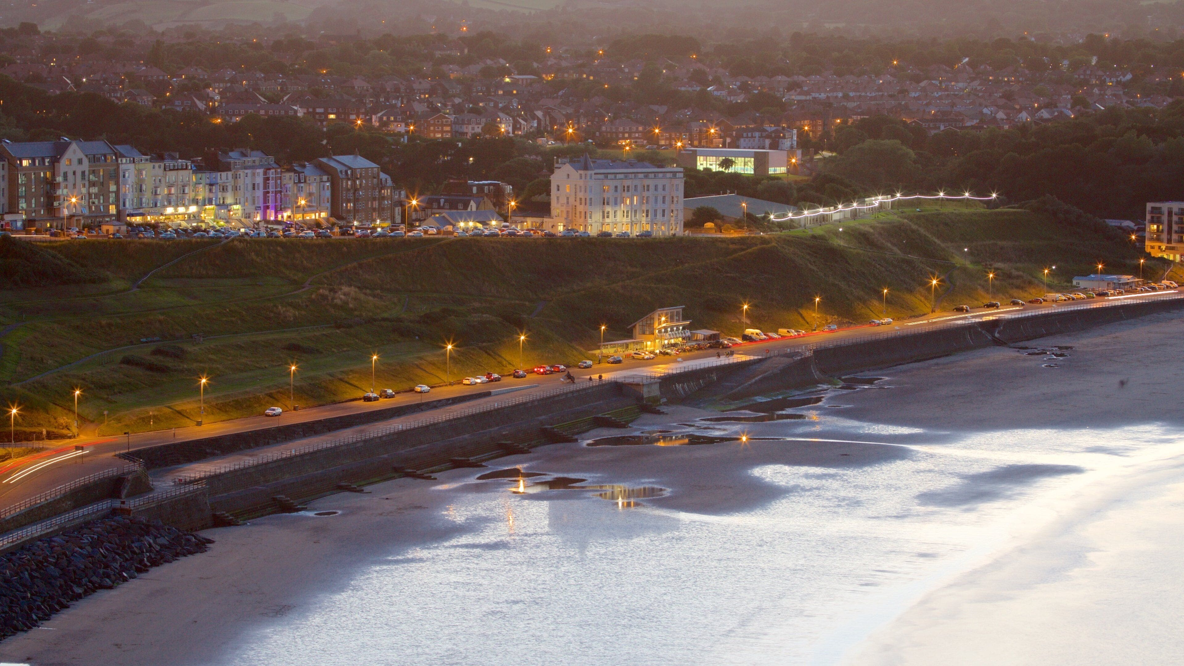 North Bay Beach featuring landscape views, night scenes and a sandy beach