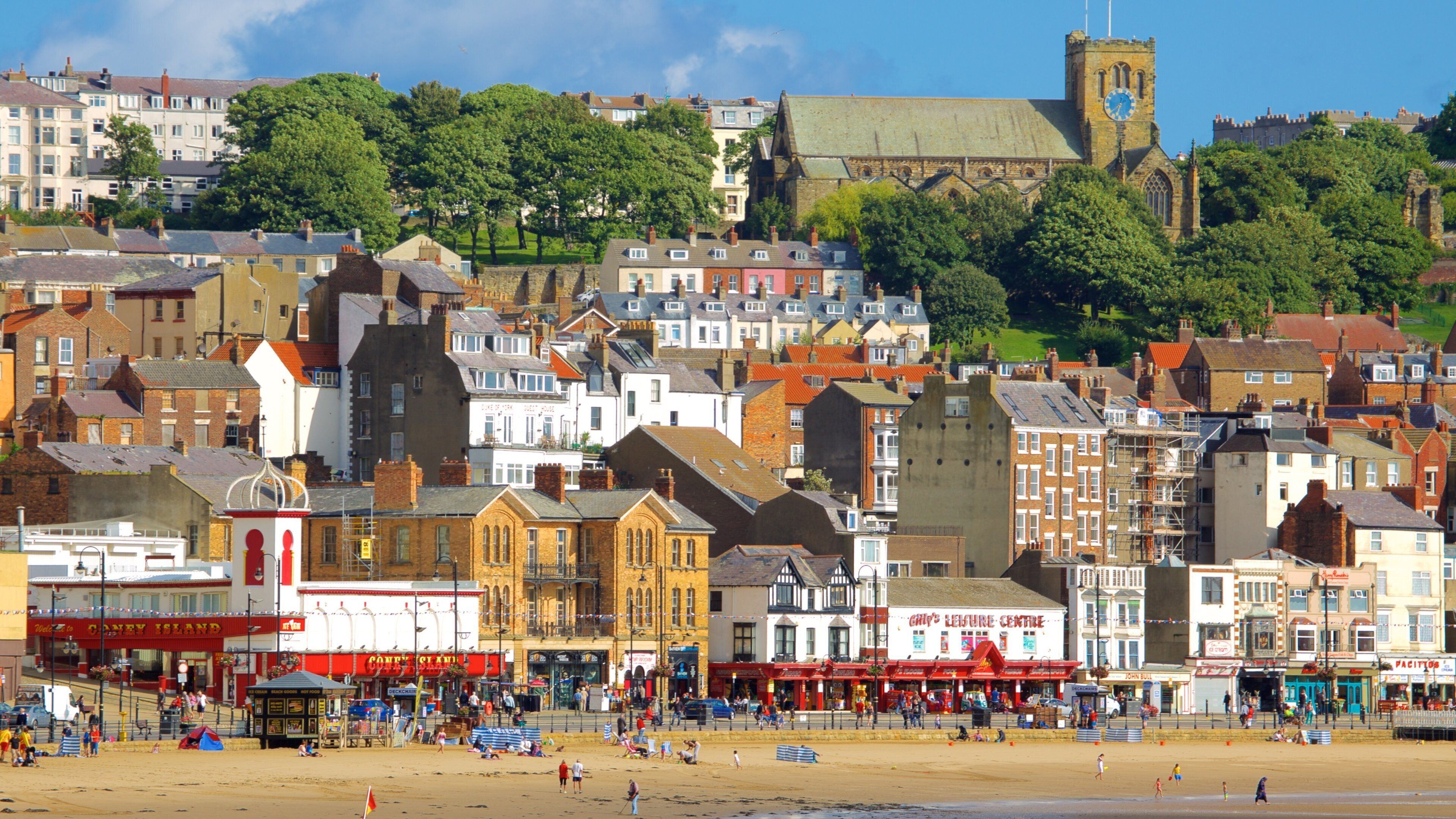 South Bay Beach showing a coastal town and a sandy beach