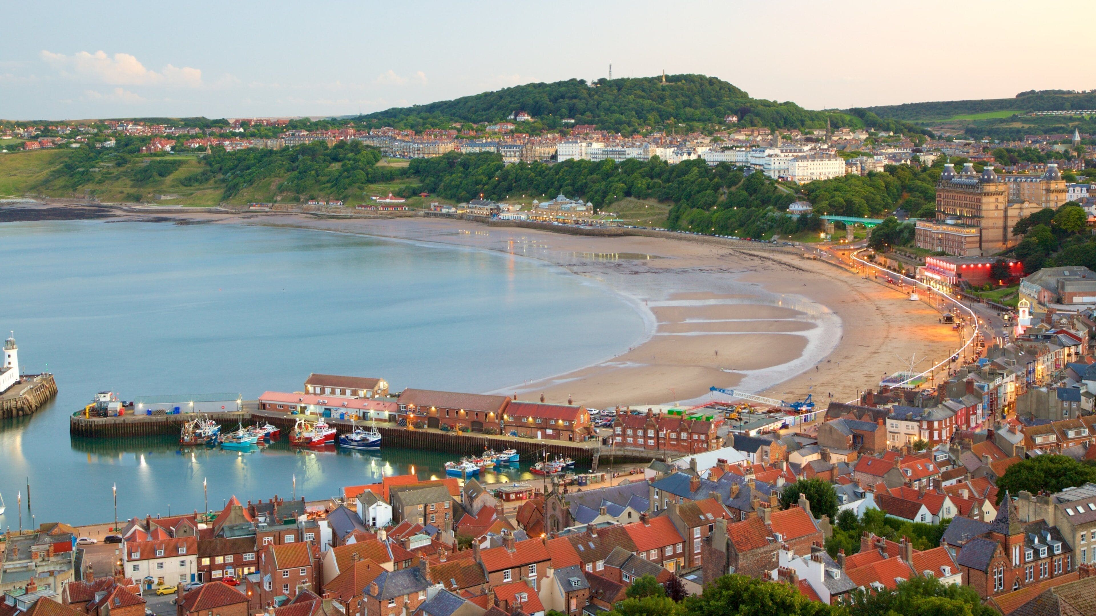 South Bay Beach which includes a sandy beach and a coastal town
