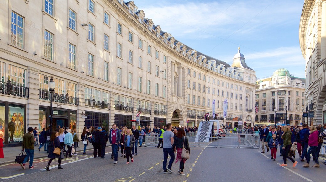 Regent Street featuring street scenes and heritage architecture as well as a large group of people