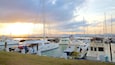 Cebu Yacht Club which includes a bay or harbor and a sunset