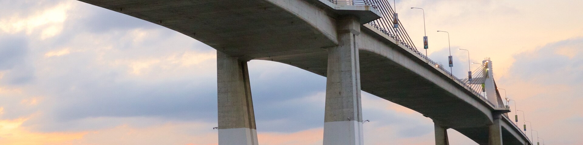 Marcelo Fernan Bridge featuring a sunset and a bridge