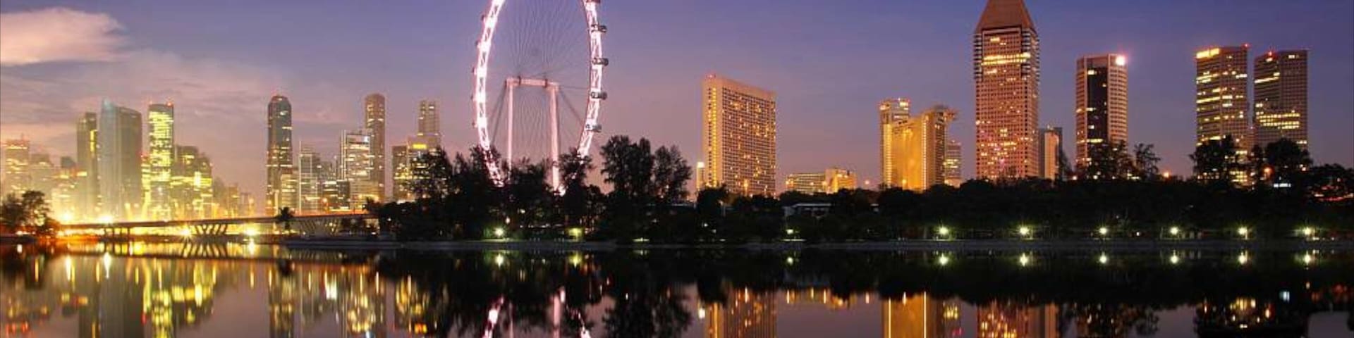 Singapore Flyer featuring night scenes, modern architecture and a skyscraper