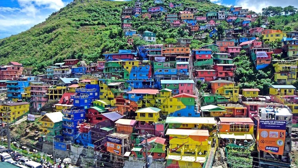 A huge, colorful mural is painted on houses on the hillside community of Stonehill, Botiwtiw and Sadjap (STOBOSA) in Barangay Balili, La Trinidad, Benguet Philippines.
#colorful#village#details#philippines
