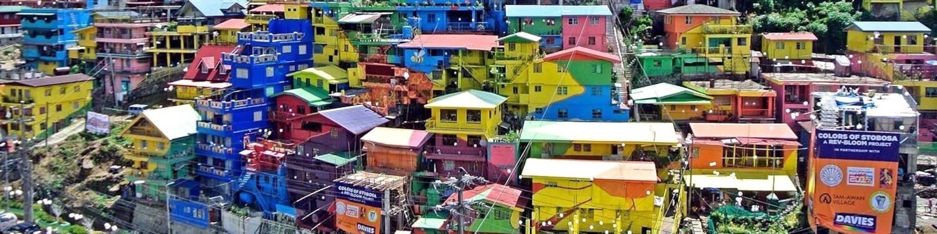 A huge, colorful mural is painted on houses on the hillside community of Stonehill, Botiwtiw and Sadjap (STOBOSA) in Barangay Balili, La Trinidad, Benguet Philippines.
#colorful#village#details#philippines