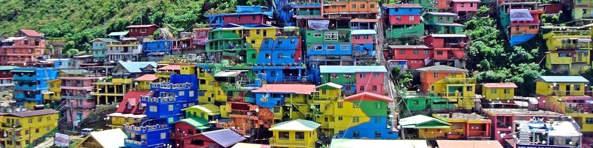 A huge, colorful mural is painted on houses on the hillside community of Stonehill, Botiwtiw and Sadjap (STOBOSA) in Barangay Balili, La Trinidad, Benguet Philippines.
#colorful#village#details#philippines