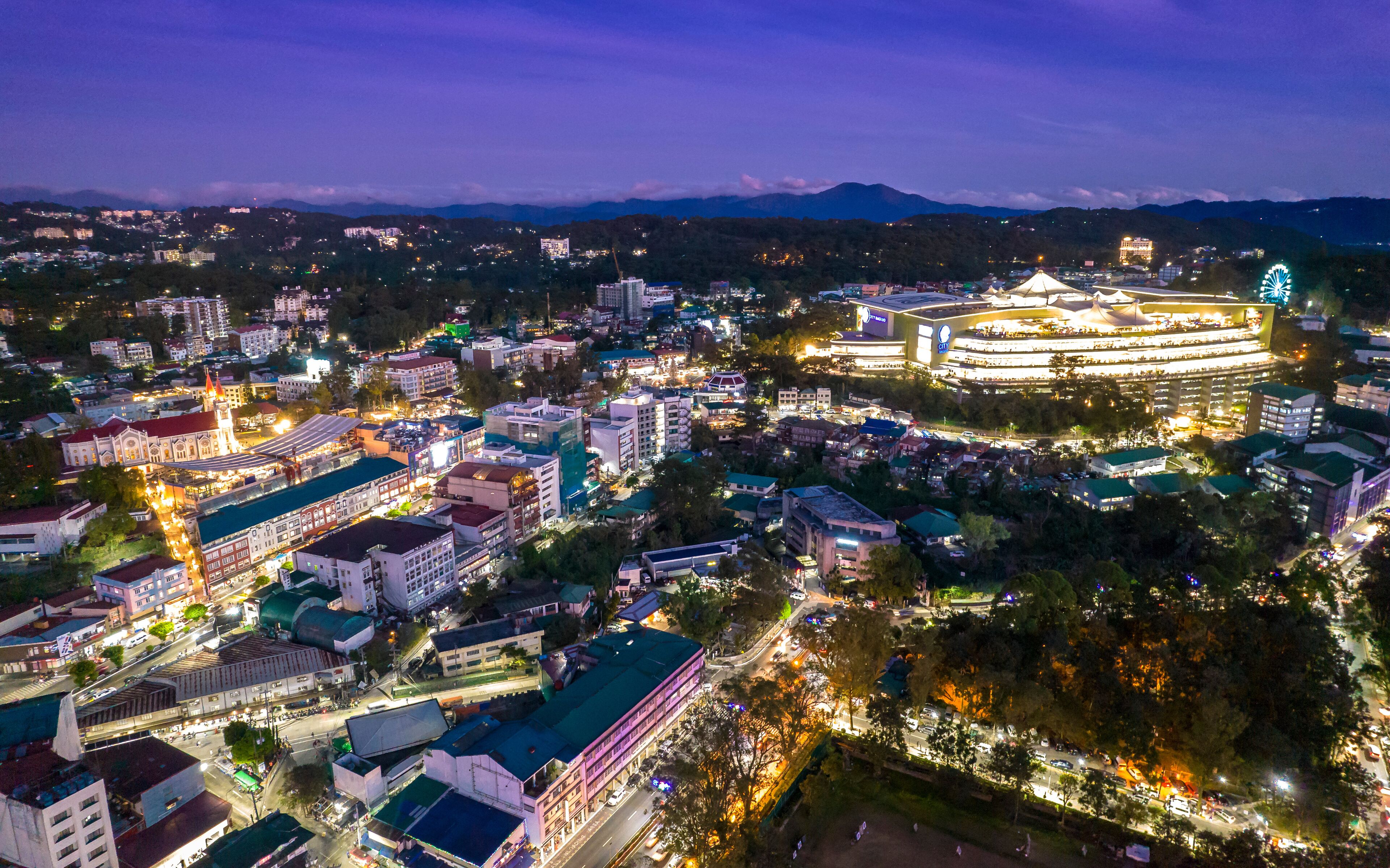 Baguio City, Philippines - Aerial of Baguio Catherdral, buildings along session road, and SM.