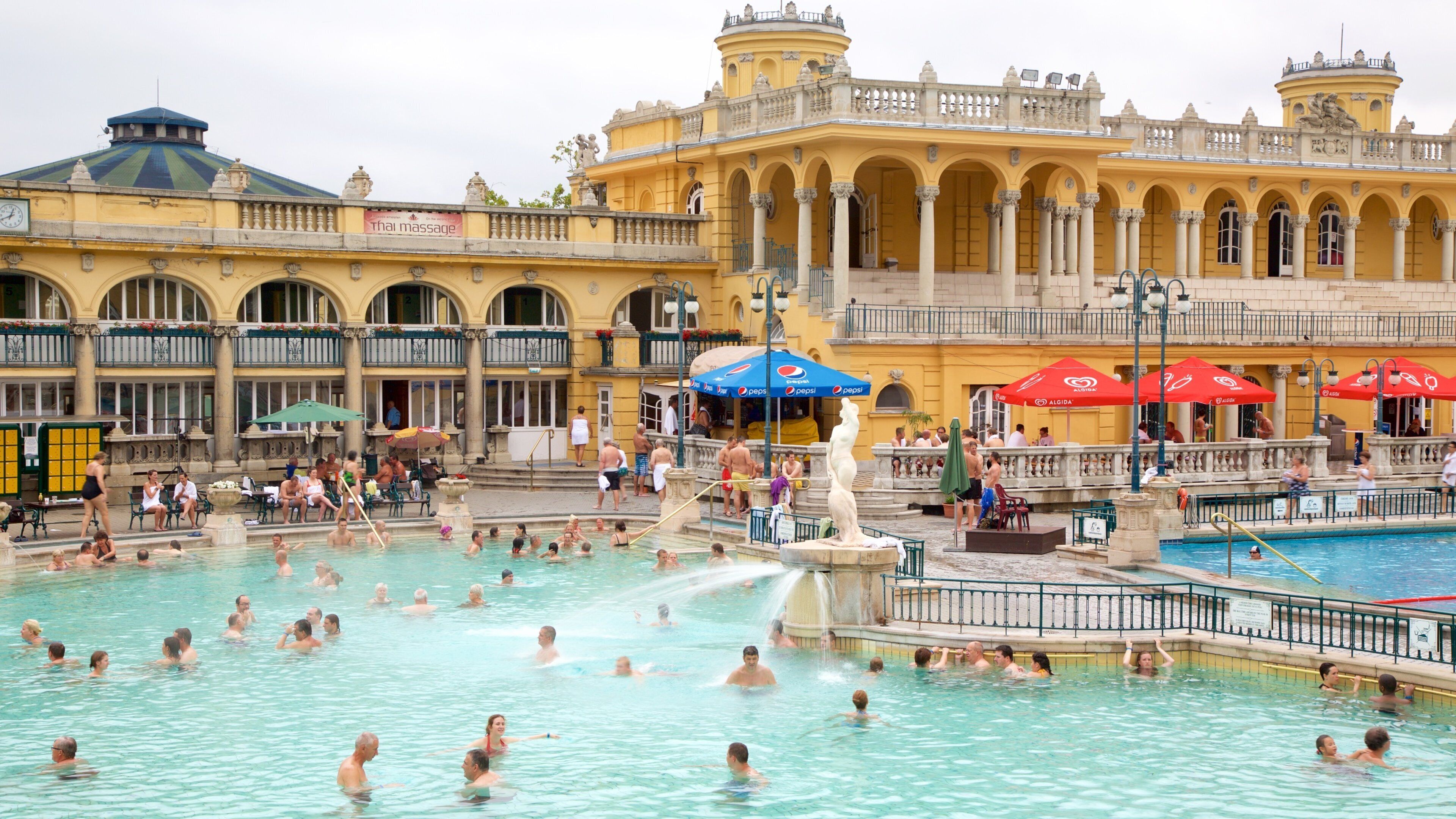 Szechenyi Thermal Bath showing a day spa, heritage architecture and a pool