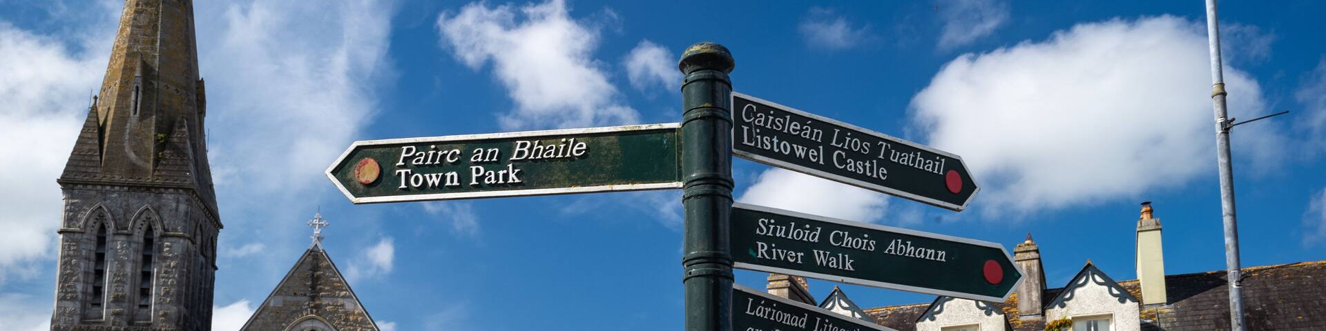 Direction signs for places of interest in the town of Listowel, county Kerry, Ireland.