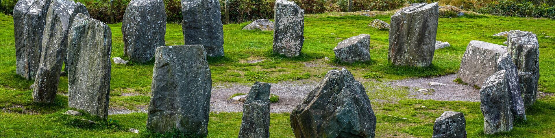 Closeup of Drombeg Stone Circle on a green meadow in summer, County Cork, Ireland