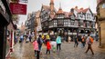 Chester which includes street scenes and heritage elements as well as a large group of people