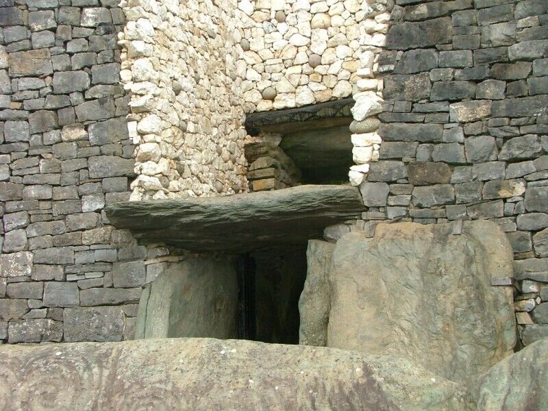 Above the entrance to the passage at Newgrange there is an opening called a roof-box. Its purpose is to allow sunlight to penetrate the passage and chamber at sunrise around the Winter Solstice. At 8:58am a narrow beam of light penetrates the roof-box and reaches the floor of the chamber, gradually extending to the rear of the passage. As the sun rises higher, the beam widens within the chamber so that the whole room becomes dramatically illuminated. After 17 minutes the sunbeam leaves the chamber and retreats back down the passage.