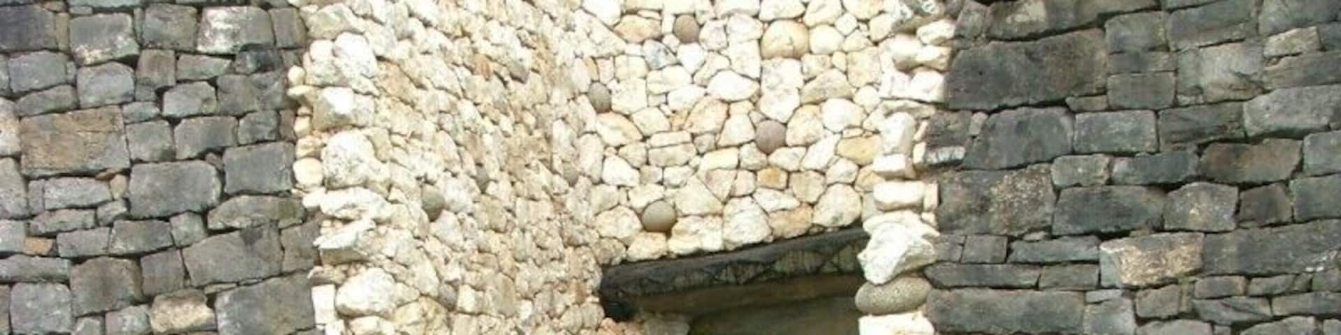 Above the entrance to the passage at Newgrange there is an opening called a roof-box. Its purpose is to allow sunlight to penetrate the passage and chamber at sunrise around the Winter Solstice. At 8:58am a narrow beam of light penetrates the roof-box and reaches the floor of the chamber, gradually extending to the rear of the passage. As the sun rises higher, the beam widens within the chamber so that the whole room becomes dramatically illuminated. After 17 minutes the sunbeam leaves the chamber and retreats back down the passage.