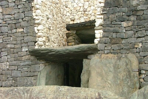 Above the entrance to the passage at Newgrange there is an opening called a roof-box. Its purpose is to allow sunlight to penetrate the passage and chamber at sunrise around the Winter Solstice. At 8:58am a narrow beam of light penetrates the roof-box and reaches the floor of the chamber, gradually extending to the rear of the passage. As the sun rises higher, the beam widens within the chamber so that the whole room becomes dramatically illuminated. After 17 minutes the sunbeam leaves the chamber and retreats back down the passage.