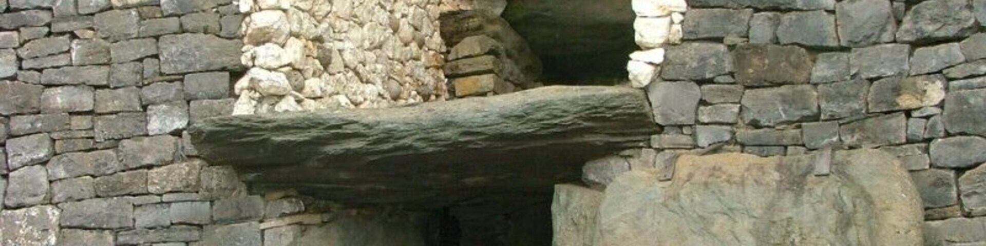 Above the entrance to the passage at Newgrange there is an opening called a roof-box. Its purpose is to allow sunlight to penetrate the passage and chamber at sunrise around the Winter Solstice. At 8:58am a narrow beam of light penetrates the roof-box and reaches the floor of the chamber, gradually extending to the rear of the passage. As the sun rises higher, the beam widens within the chamber so that the whole room becomes dramatically illuminated. After 17 minutes the sunbeam leaves the chamber and retreats back down the passage.