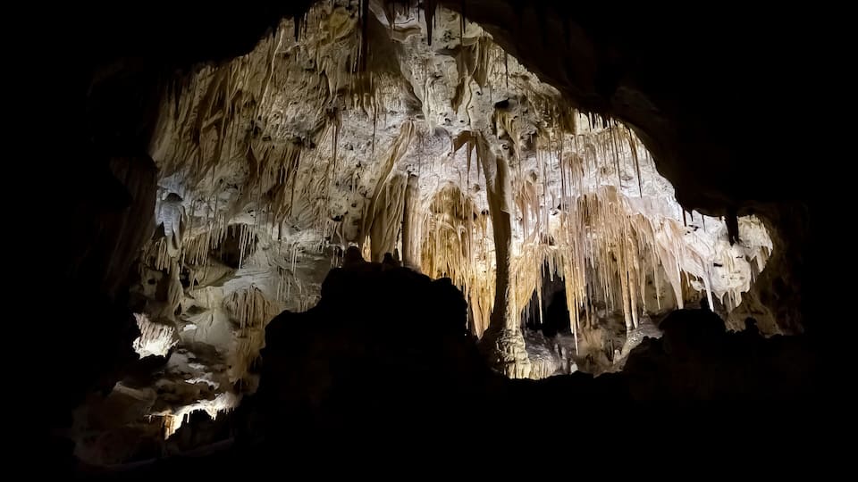 USA, New Mexico, Eddy County, Carlsbad Caverns National Park. A view of the calcite cave formations of columns, stalactities, and stalagmites underground below the Guadelupe Mountains.