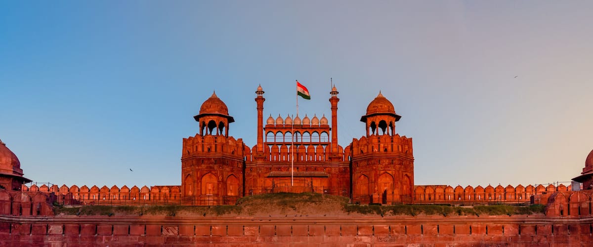 Red Fort is a historic fort UNESCO world Heritage Site at Delhi. On Independence day, the Prime Minister hoists Indian flag at main gate of fort & delivers nationally broadcast speech from its rampart