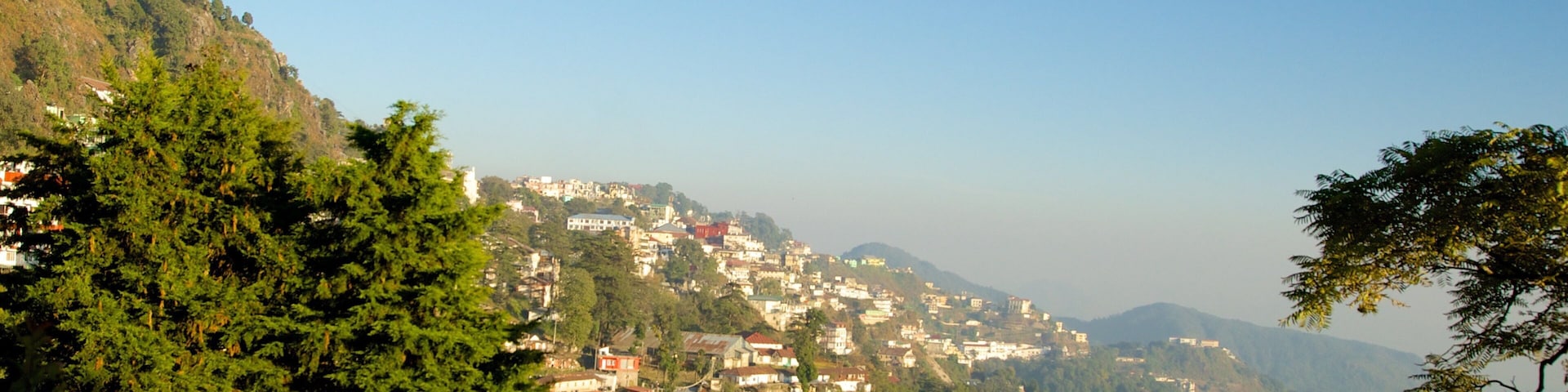 Gun Hill which includes tranquil scenes and a small town or village