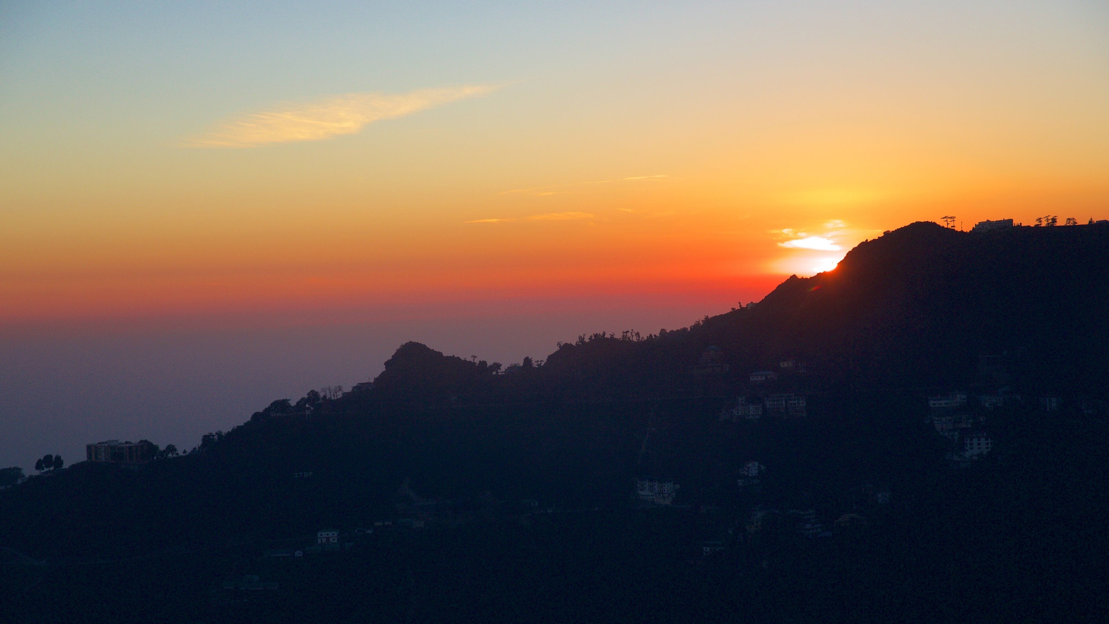 Gun Hill which includes a sunset