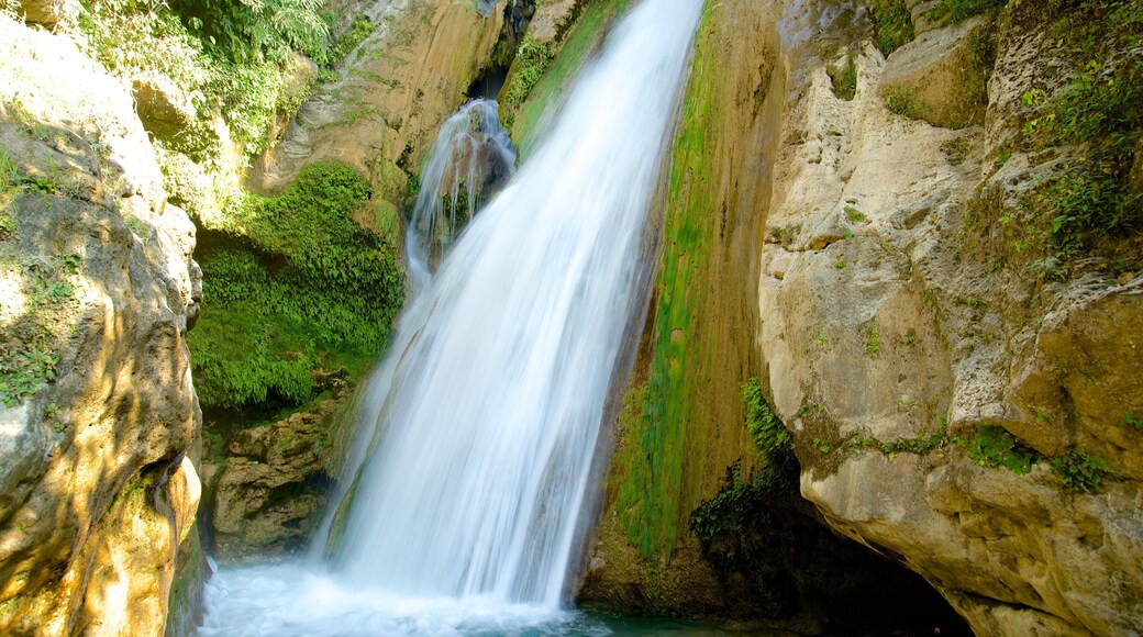 Bhata Falls featuring a cascade and a river or creek