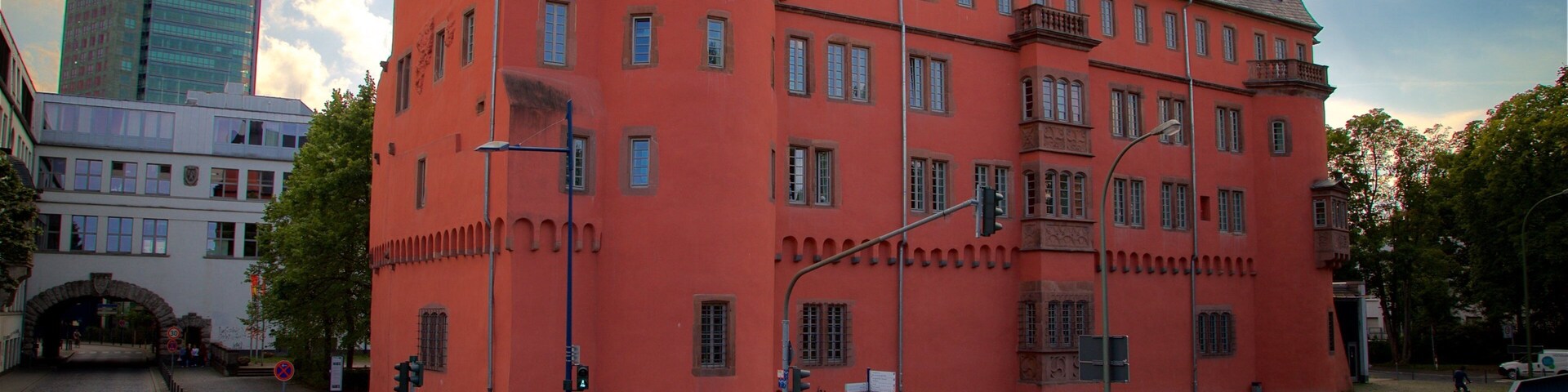 Buesing Palais which includes a city, a sunset and heritage architecture