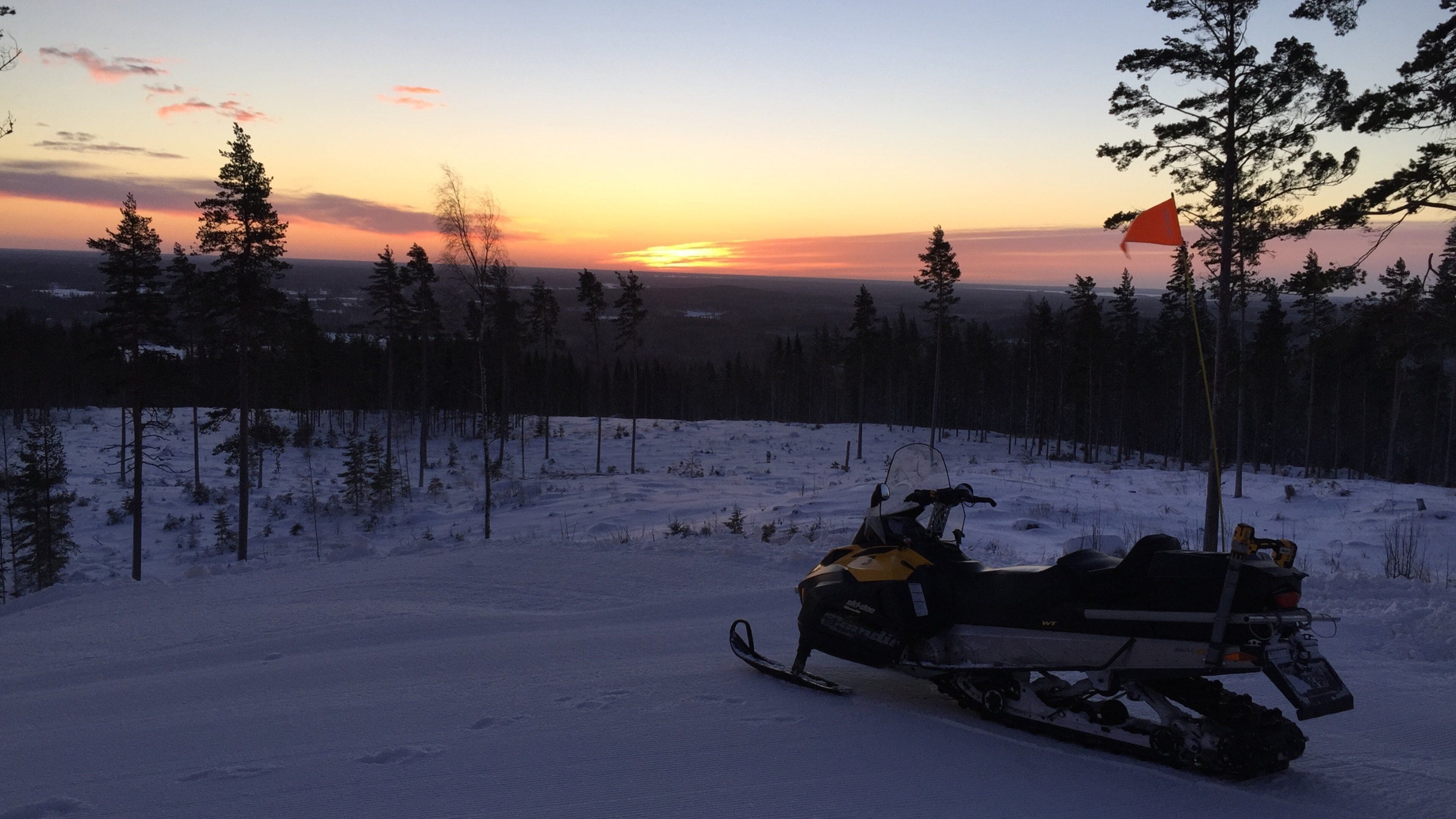 Kungsberget Ski Resort featuring snowmobiling, snow and a sunset