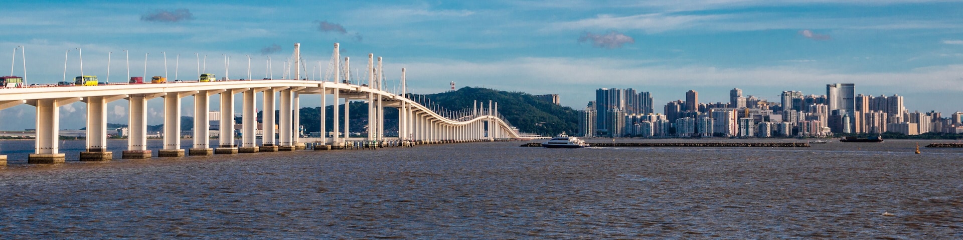 Great panoramic view on a sunny day of the Macau Friendship Bridge or Amizade Bridge which connects the peninsula and Taipa Island across the Zhujiang River estuary where most of the casinos are.