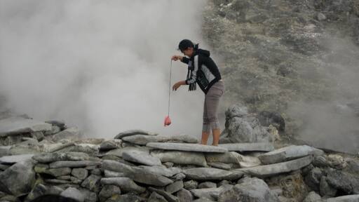 Boiling an egg in the heat from the sulphur outlets. It was hot and smelly down in the crater. But this was a unique experience because it came without all the precautions normally put in place for tourists - that's good and bad don't you think? #crater