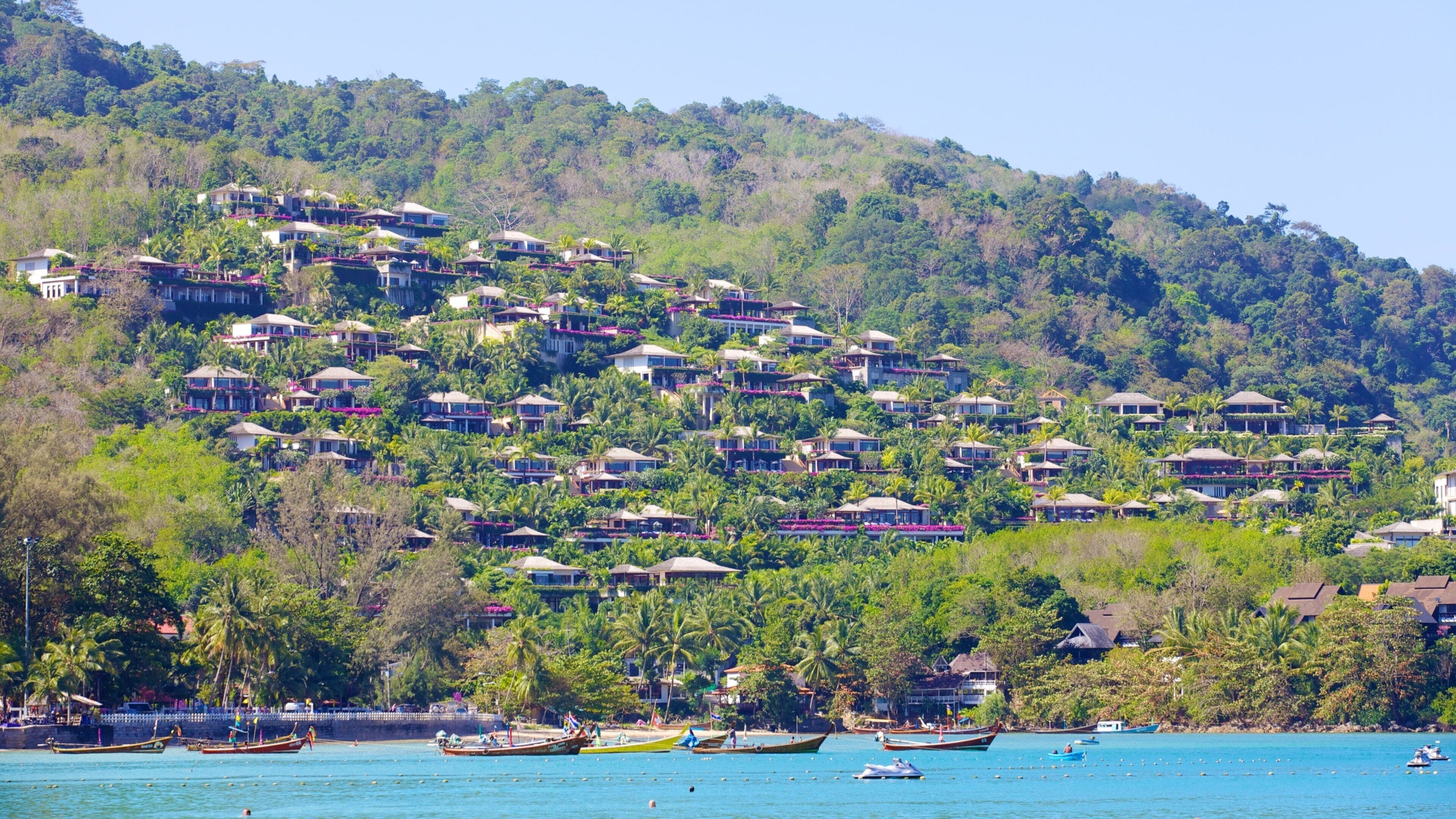 Kamala Beach showing a coastal town, boating and a bay or harbor