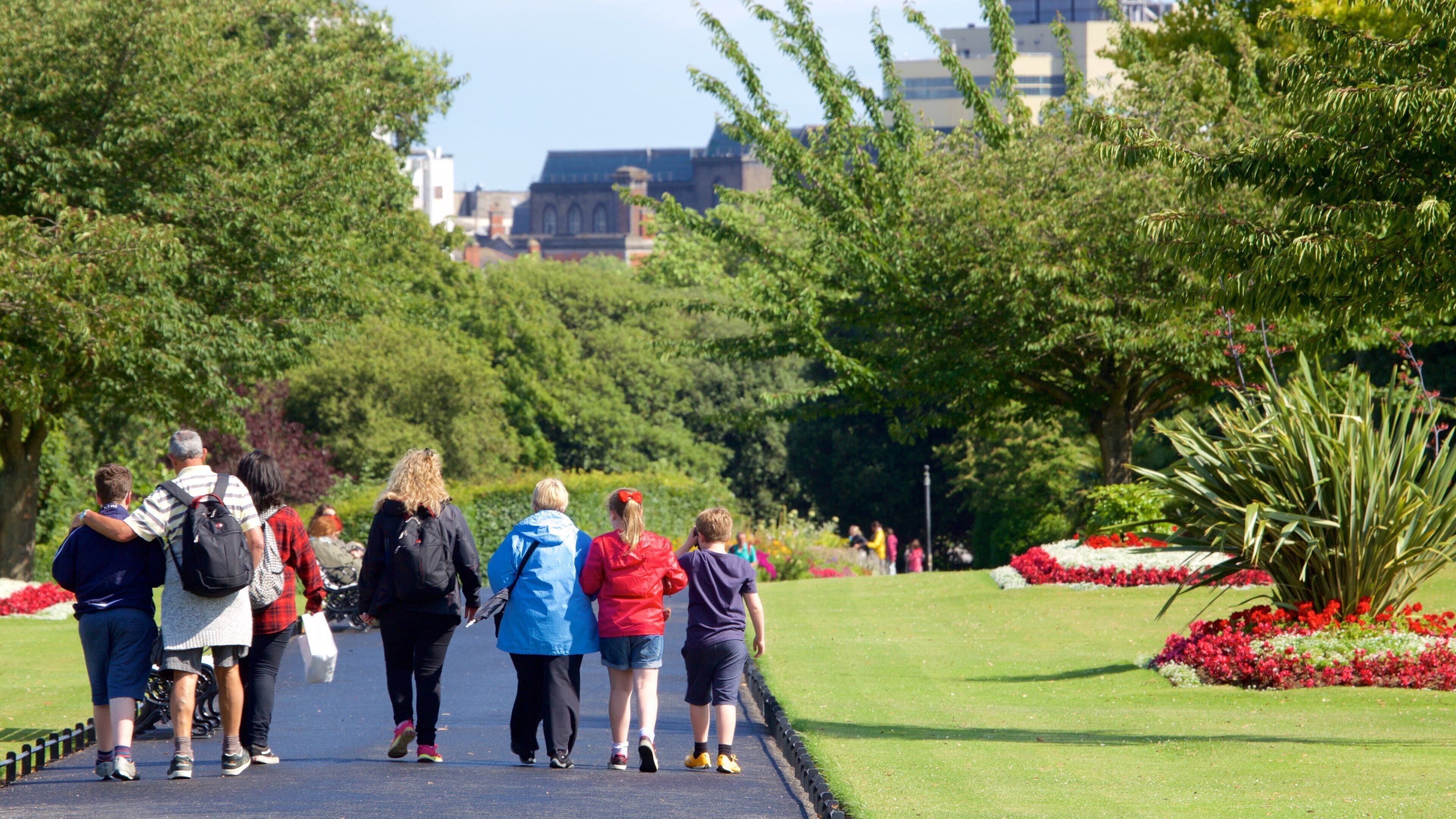 Phoenix Park which includes a garden and flowers as well as a small group of people