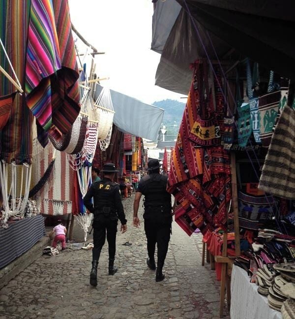 Police guard patrolling the market . Wonder if they buy anything sometimes :-)