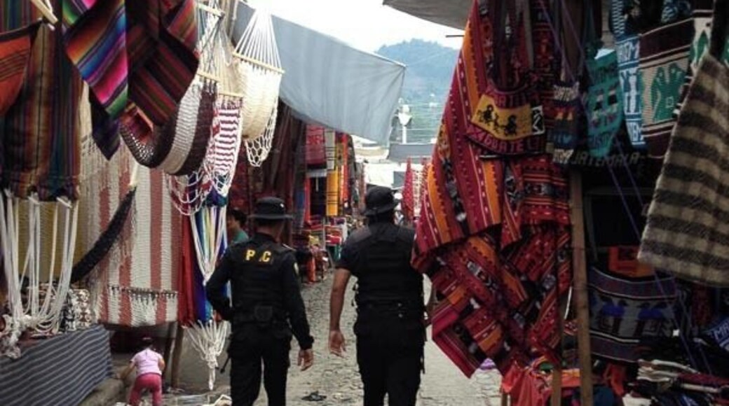 Police guard patrolling the market . Wonder if they buy anything sometimes :-)