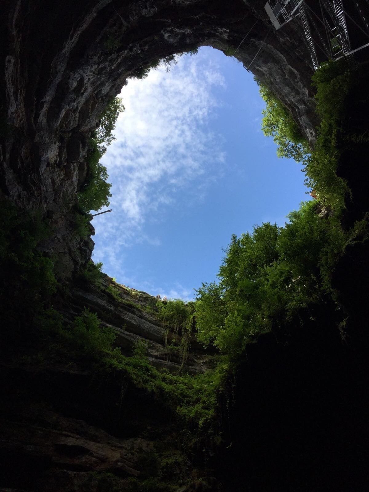 Going 95 meters down. 

This cave was absolutely amazing, incredibly beautiful with interesting stories told by guides. 
However, important to note, that it's really wet, there's water dripping from the "ceiling" in certain areas, the path is flooded everywhere. 
Of course, you should wear a pair of sports shoes and warm cloths. When you arrive there, you have to get downstairs either on foot taking stairs or by taking an elevator. Once you reached the bottom of the cave, you'll be offered a little boat trip to the other side of the cave where the guides meet you and are ready to tell you about the history of the cave. 
Fun fact: I was lucky enough to see a red frog in the water since it's an extremely rare thing to see living creatures there as they don't "show themselves" too often. 
Personally, I enjoyed it and would advise to visit it. I probably would not visit it again as I've been to plenty of caves before but this one is definitely worth a shot. 