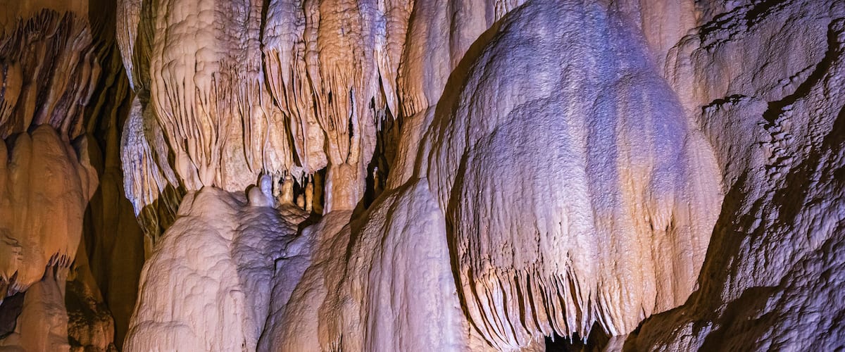 A cave with stalactites and stalagmites.