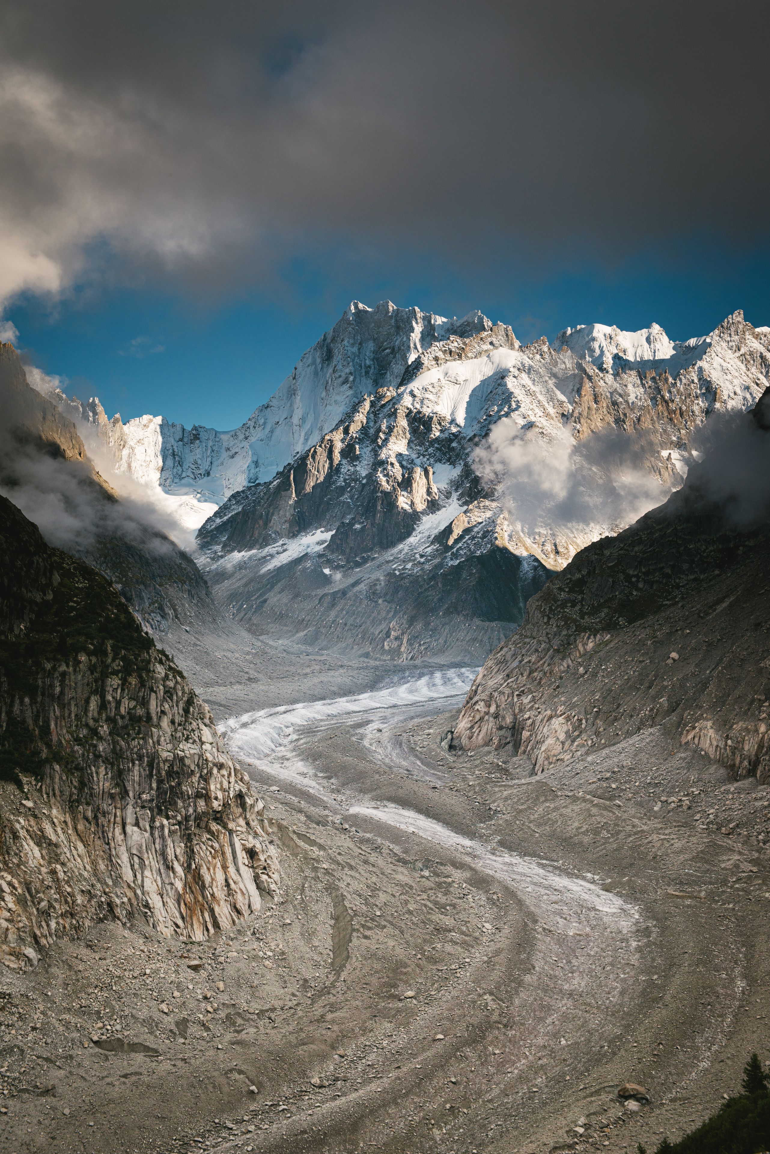 A snow-covered mountain range with a glacier.