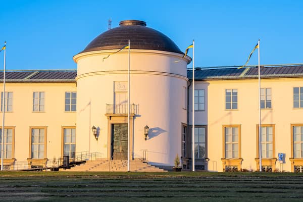The building of Maritime museum in Stockholm with flags in front of it