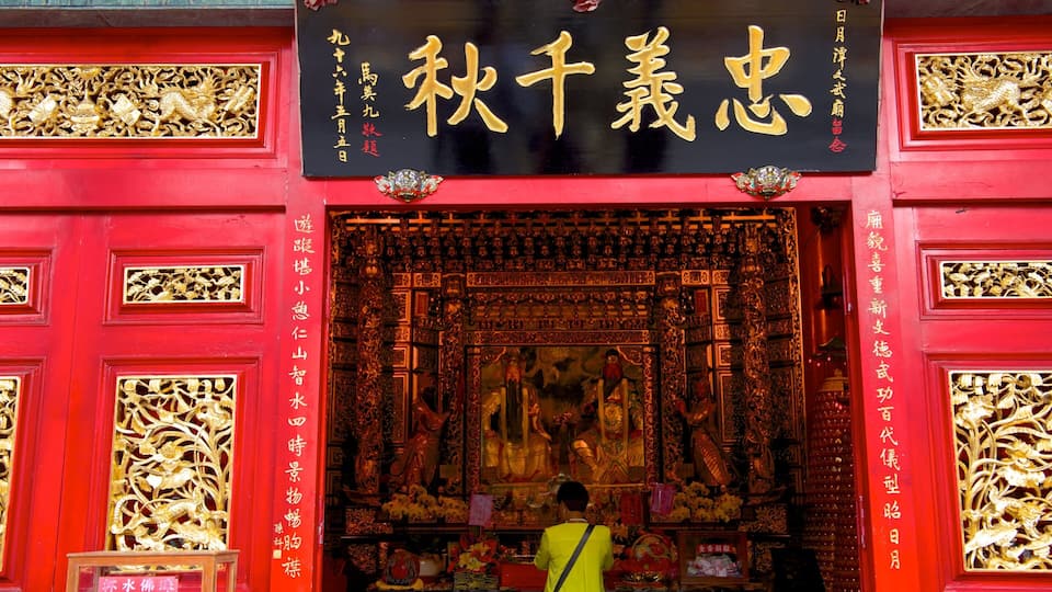 A red temple with gold decorations and Chinese characters.