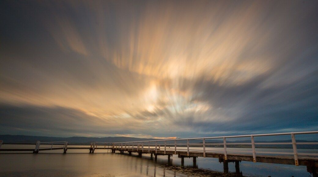 Dramatic sky over a wooden jetty on Lake Illawarra, Shellharbour Area, Wollongong, New South Wales, Australia