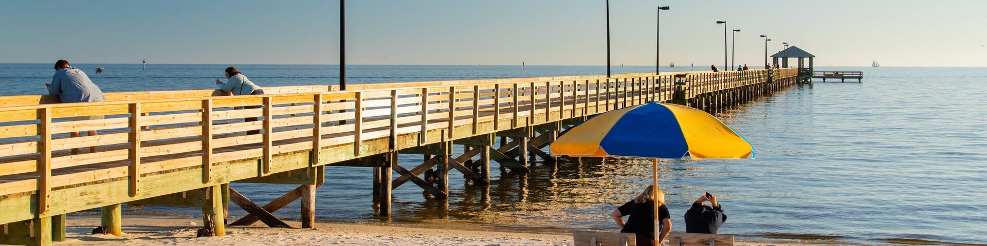 Biloxi Beach which includes a beach and general coastal views as well as a couple