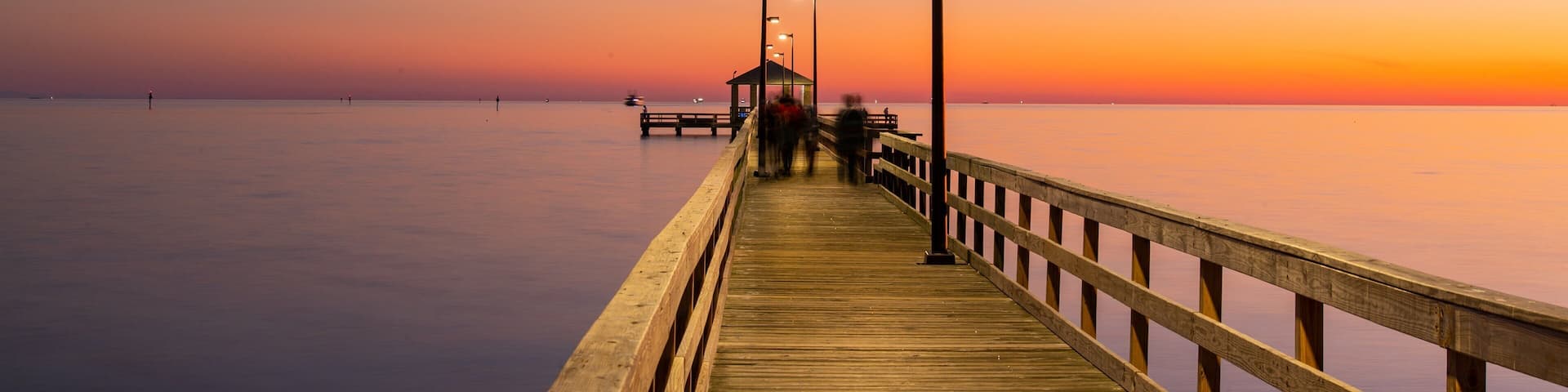 Biloxi Beach showing a sunset and general coastal views