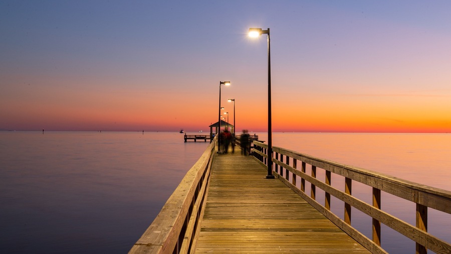Biloxi Beach showing a sunset and general coastal views