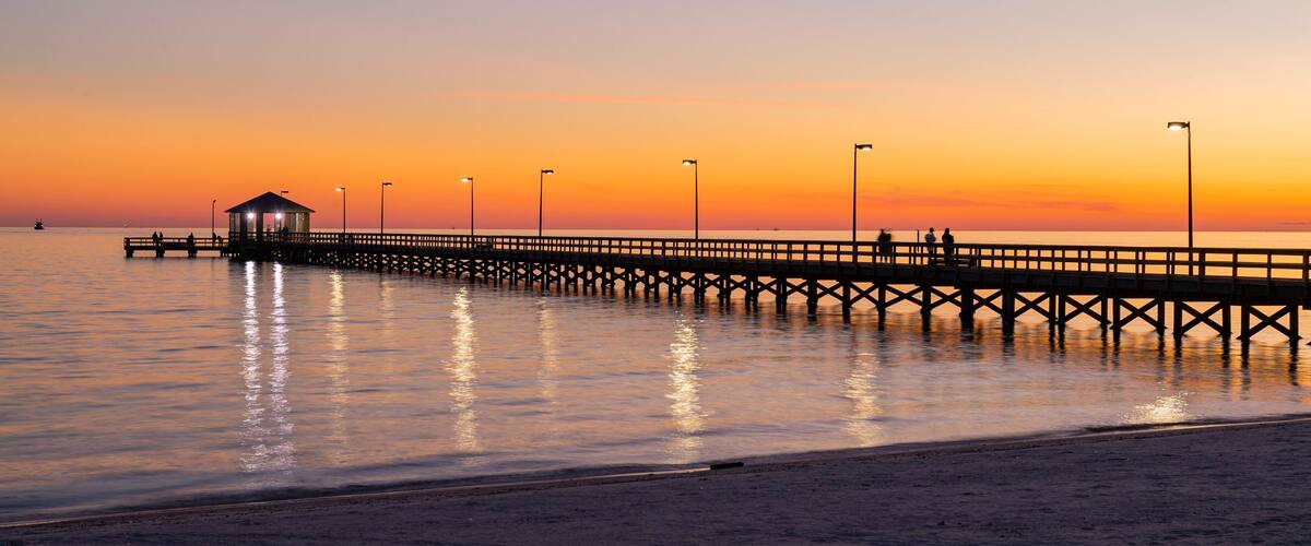 Biloxi Beach showing a sunset and general coastal views