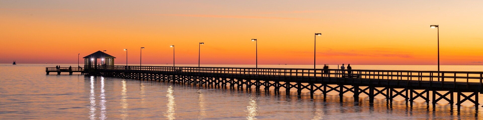 Biloxi Beach showing a sunset and general coastal views