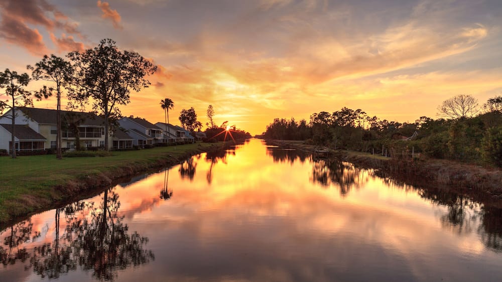 Golden sunset over a Gordon River tributary that winds through Golden Gate