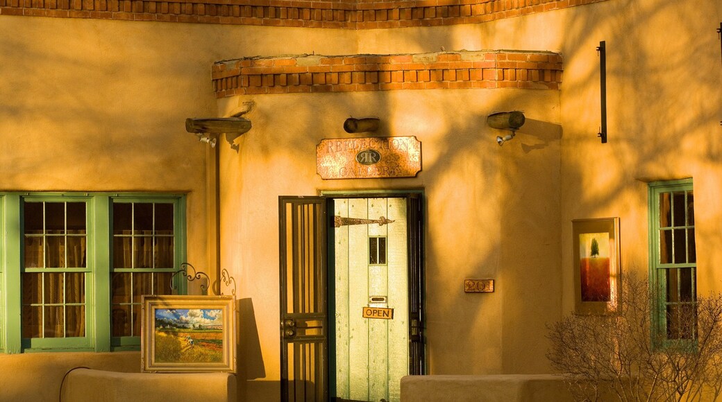 Canyon Road featuring heritage architecture and a sunset