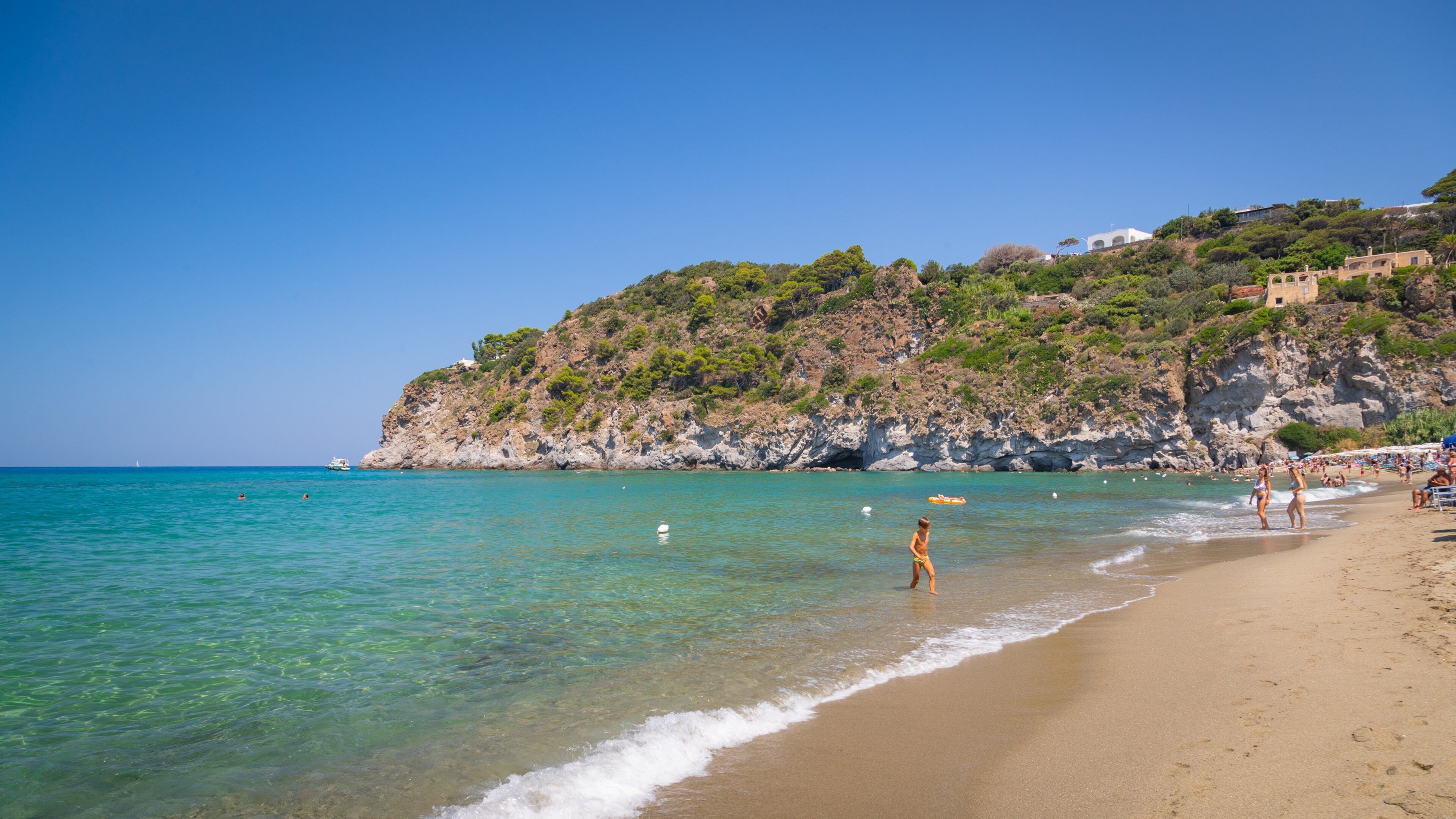 San Francesco Beach which includes general coastal views, rocky coastline and a beach