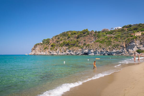 San Francesco Beach which includes general coastal views, rocky coastline and a beach