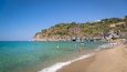 San Francesco Beach which includes general coastal views, rocky coastline and a beach