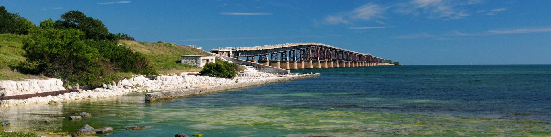 View To Old Bahia Honda Bridge, Part Of The Florida Keys Overseas Heritage Trails, From West Summerland Key On A Sunny Autumn Day With A Clear Blue Sky And A Few Clouds